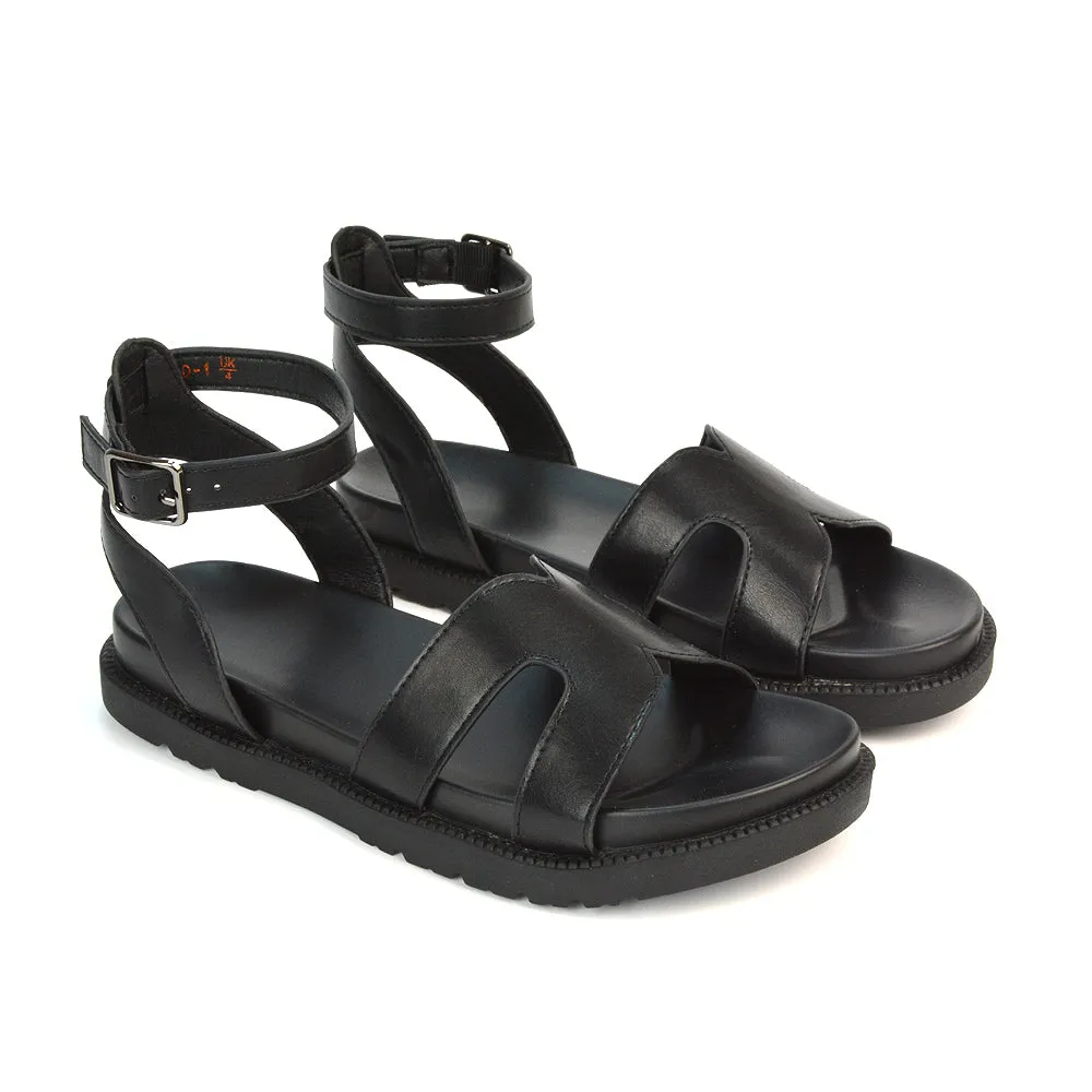 Eboni Ankle Strap Flatform Cut Out Flat Festival Sandals in Black Synthetic Leather